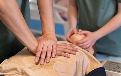 Students learning CPR and AED techniques during Basic Emergency Life Support courses in Everton Park QLD